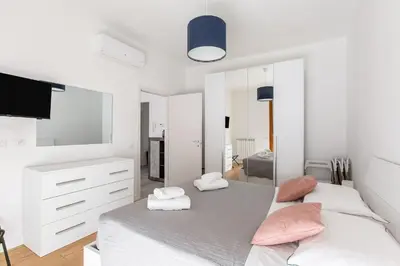 Letto o letti in una camera di GuestHost - Novella Fiorentina - San Jacopino Apartment