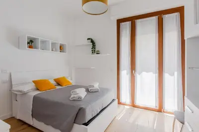 Letto o letti in una camera di GuestHost - Novella Fiorentina - San Jacopino Apartment