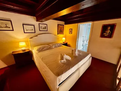 Letto o letti in una camera di Suite Brunelleschi Florence - 14th century suite just 120 steps from Cathedral - Intero appartamento