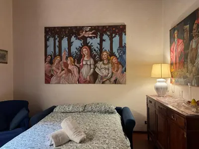 Letto o letti in una camera di Suite Brunelleschi Florence - 14th century suite just 120 steps from Cathedral - Intero appartamento