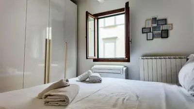 Letto o letti in una camera di Little Sweet Home in Florence