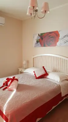 Letto o letti in una camera di Soggiorno Arcobaleno