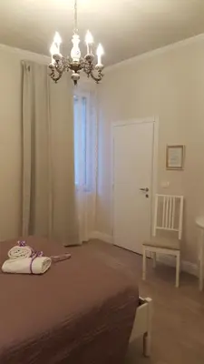 Letto o letti in una camera di Soggiorno Arcobaleno