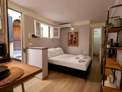 Letto o letti in una camera di Tuscan Tempo Elegant Escape near PonteVecchio
