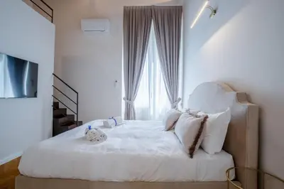 Letto o letti in una camera di Servi Deluxe Apartament