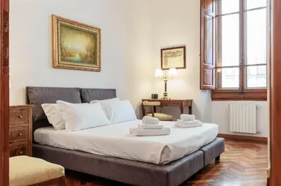 Letto o letti in una camera di Spartaco Prestigious Apartment