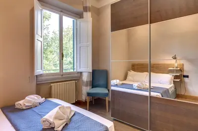 Letto o letti in una camera di Ridolfi Apartment by Mamo Florence