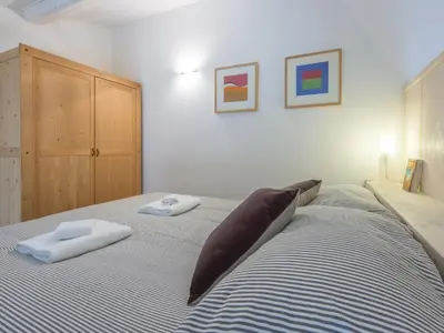 Letto o letti in una camera di San Lorenzo Bright Loft