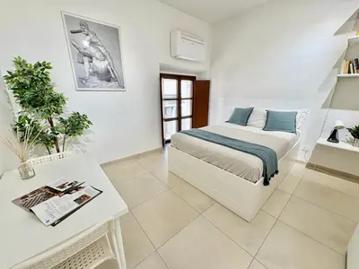 Letto o letti in una camera di Duomo Modern Suite