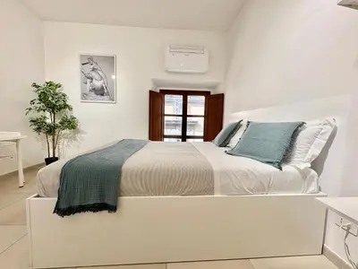 Letto o letti in una camera di Duomo Modern Suite