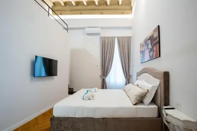Letto o letti in una camera di Dimora Nuvola Apartament
