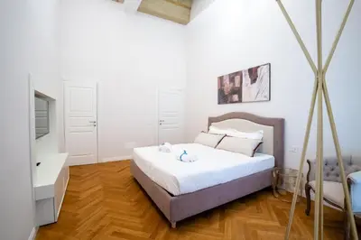 Letto o letti in una camera di Dimora Nuvola Apartament