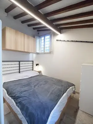 Letto o letti in una camera di Dante, apartment in the historic center