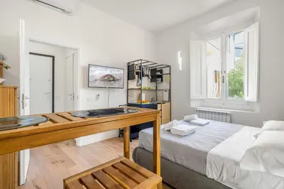 Letto o letti in una camera di GuestHost - Santa Maria Novella Nest - Vittoria & Carlo Apartments
