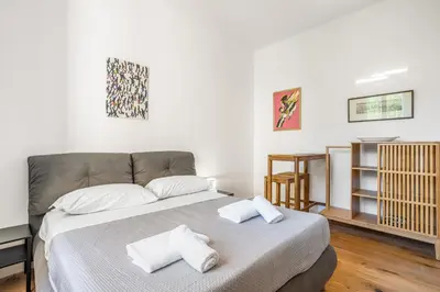 Letto o letti in una camera di GuestHost - Santa Maria Novella Nest - Vittoria & Carlo Apartments