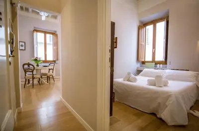 Letto o letti in una camera di Acacia Firenze - Peonia