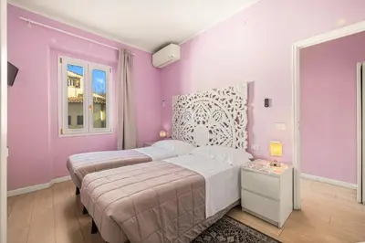 Letto o letti in una camera di Passera history view residence C&G