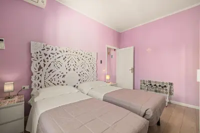 Letto o letti in una camera di Passera history view residence C&G