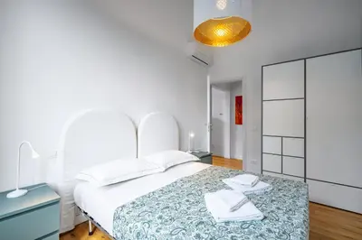 Letto o letti in una camera di GuestHost - Casa di Ebe - Campo di Marte Flat with Balcony
