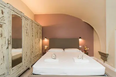 Letto o letti in una camera di UNYCA - Florence Renaissance Apartment