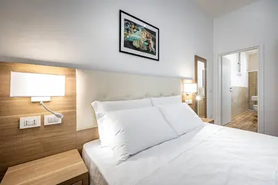 Letto o letti in una camera di YD elegant apt with garden