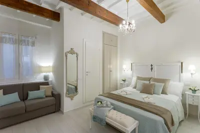 Letto o letti in una camera di Elegante Appartamento a 3 Minuti dal Duomo