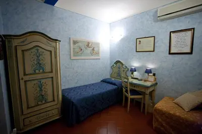 Letto o letti in una camera di Locanda dei Poeti Rooms & Apartments