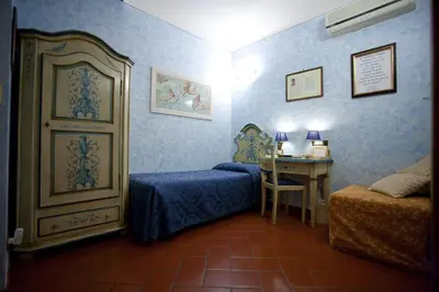 Letto o letti in una camera di Locanda dei Poeti Rooms & Apartments