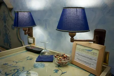 Letto o letti in una camera di Locanda dei Poeti Rooms & Apartments