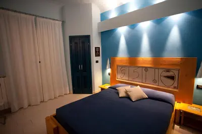 Letto o letti in una camera di Locanda dei Poeti Rooms & Apartments