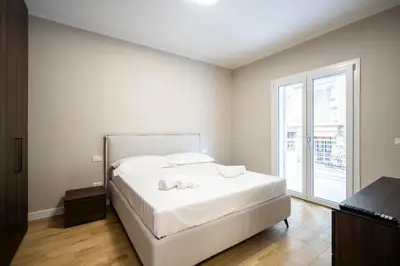 Letto o letti in una camera di Tramvia Royale Suites - Private Free Parking