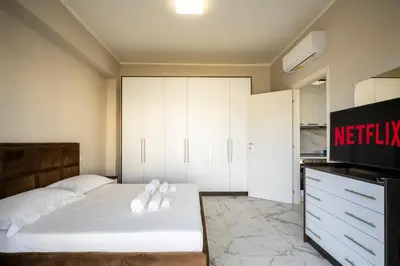 Letto o letti in una camera di Maragliano Prestige Apartments - A Due Passi dalla Tramvia
