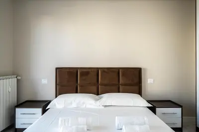 Letto o letti in una camera di Maragliano Prestige Apartments - A Due Passi dalla Tramvia