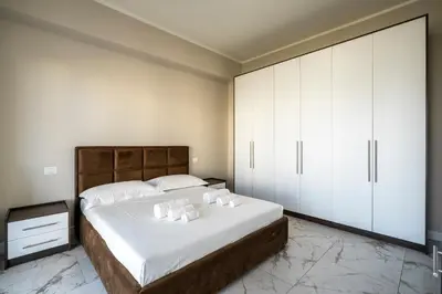 Letto o letti in una camera di Maragliano Prestige Apartments - A Due Passi dalla Tramvia