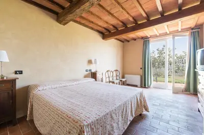 Letto o letti in una camera di I Casali del Trebbiolo