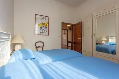 Letto o letti in una camera di Casa Angelina