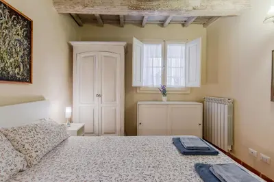 Letto o letti in una camera di GuestHost - The Sun of Florence Home