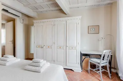 Letto o letti in una camera di GuestHost - The Sun of Florence Home