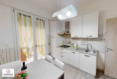 Cucina o angolo cottura di Deledda Apartment by Florence Sweet Homes