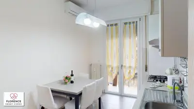 Cucina o angolo cottura di Deledda Apartment by Florence Sweet Homes