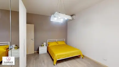 Letto o letti in una camera di Deledda Apartment by Florence Sweet Homes