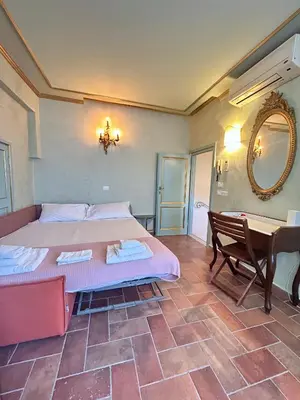 Letto o letti in una camera di Florentine Penthouse by FlorenceHospitality com
