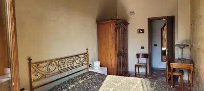 Letto o letti in una camera di Vista su giardini storici in Oltrarno