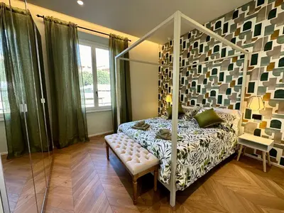 Letto o letti in una camera di Chic Mamma Charme Suite