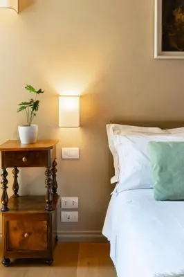 Letto o letti in una camera di Golden Luxe - Lux Penthouse Palazzo Strozzi