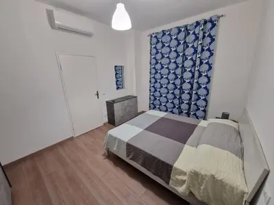 Letto o letti in una camera di Appartamento Achille