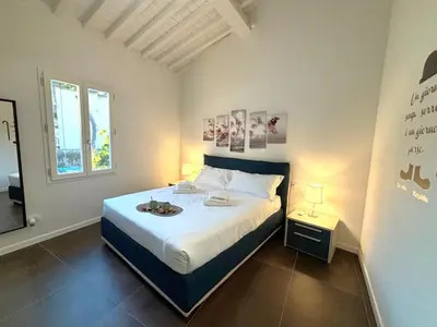 Letto o letti in una camera di Purple Lily Apartment