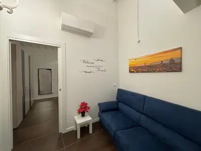 Area soggiorno di Purple Lily Apartment