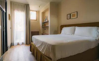 Letto o letti in una camera di c-hotels Alamanni21