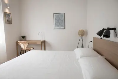 Letto o letti in una camera di Leopoldo Cozy Loft - Tramvia vicino casa